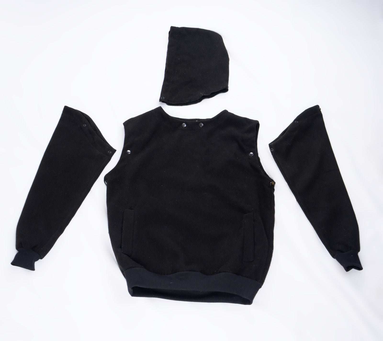 The Black Modular Hoodie taken apart: hood, body and both sleeves